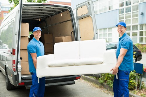 Man with van loading furniture for a local move in Wimbledon