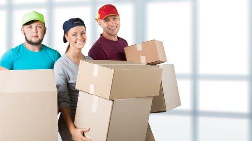 Loading furniture into a van for a Wimbledon move