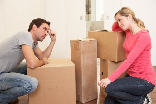Professional movers packing and protecting household items for a Wimbledon home move