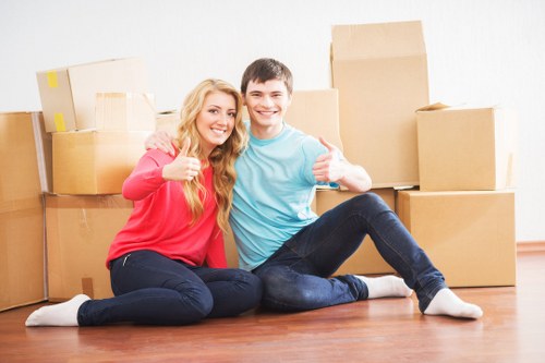 Professional Wimbledon moving team handling furniture carefully