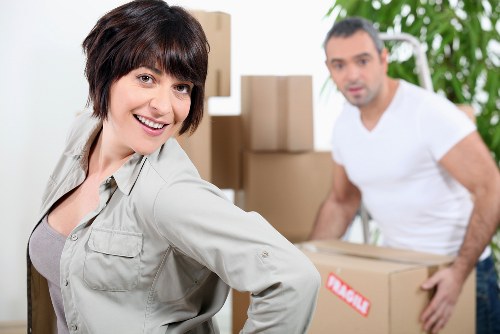 Professional movers handling office furniture in Wimbledon