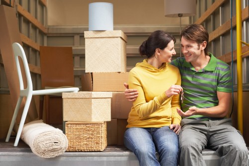 Packed household boxes and furniture ready for a Wimbledon house relocation